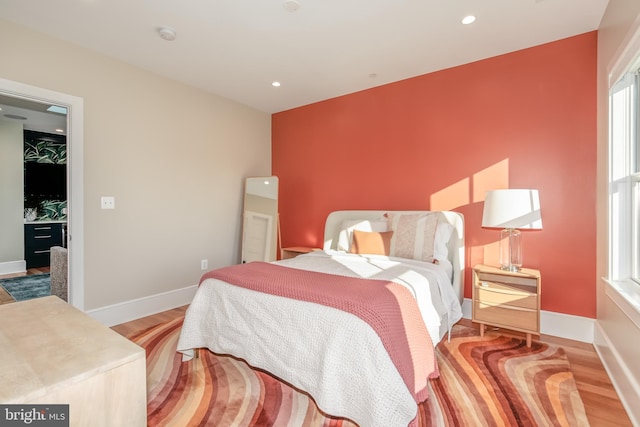 bedroom with light hardwood / wood-style flooring