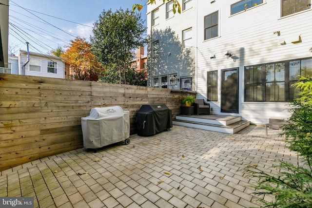 view of patio / terrace featuring a grill and a deck