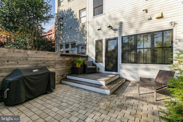 view of patio featuring grilling area and a wooden deck