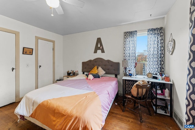 bedroom with wood-type flooring and ceiling fan