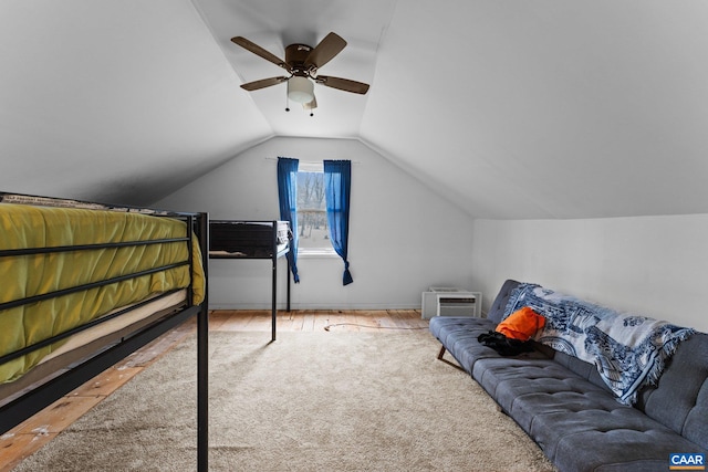 bedroom featuring hardwood / wood-style flooring, ceiling fan, and lofted ceiling