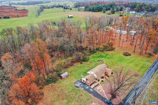 birds eye view of property featuring a rural view