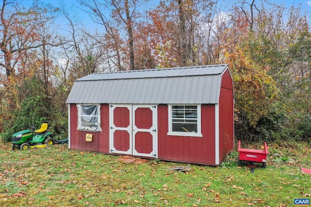 view of outbuilding with a lawn