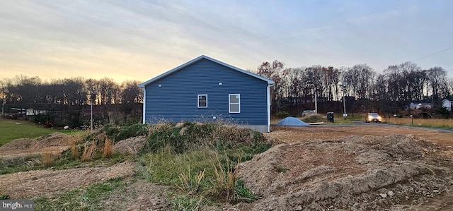 view of property exterior at dusk