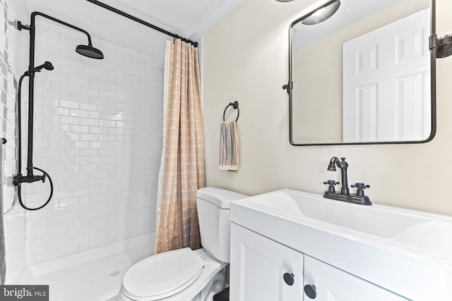 bathroom featuring curtained shower, toilet, vanity, and ornamental molding