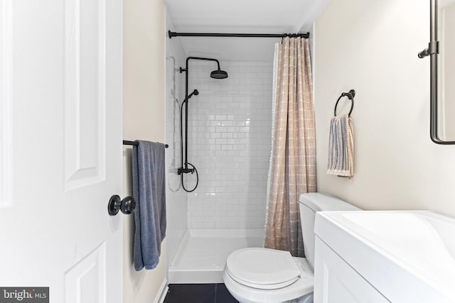 bathroom featuring a shower with curtain, tile patterned flooring, vanity, and toilet