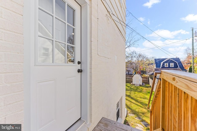 doorway to property with a yard