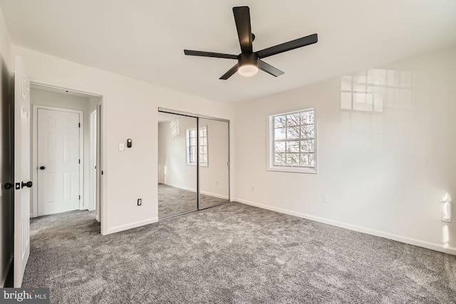 unfurnished bedroom with carpet, a closet, and ceiling fan