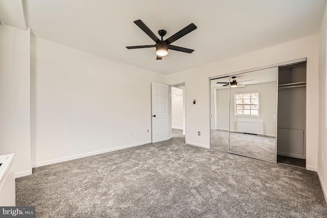 unfurnished bedroom with ceiling fan, a closet, and carpet