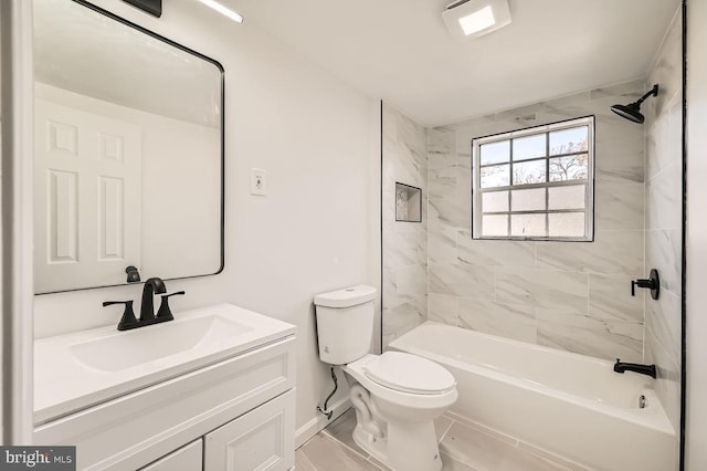 full bathroom featuring vanity, toilet, and tiled shower / bath combo