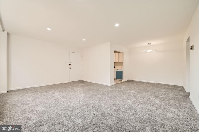 unfurnished room with carpet flooring