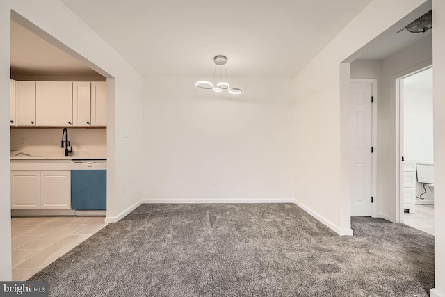 unfurnished dining area with light colored carpet