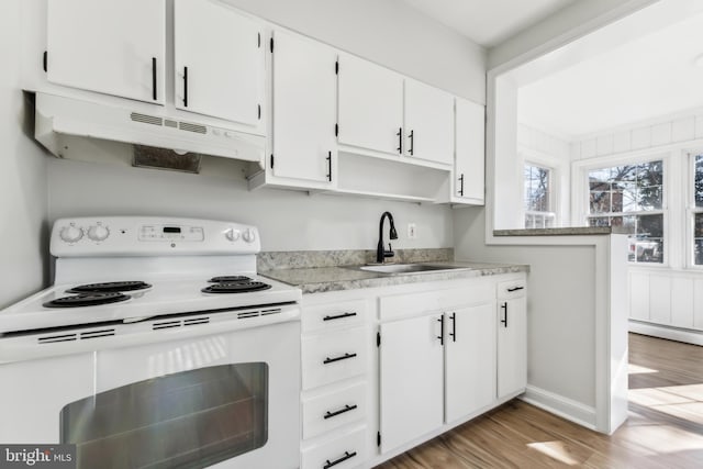 kitchen with white electric range oven, a baseboard heating unit, sink, hardwood / wood-style floors, and white cabinetry