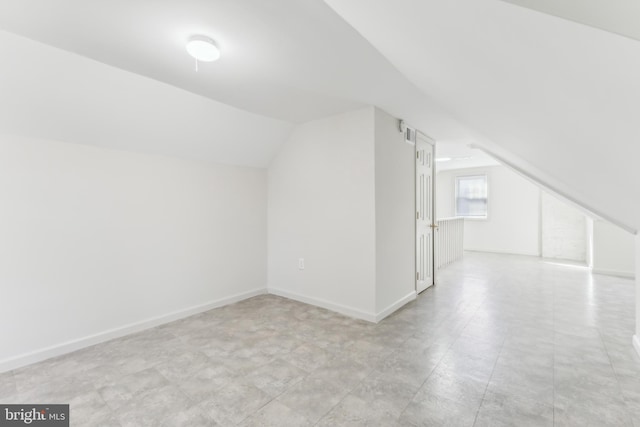 bonus room with vaulted ceiling