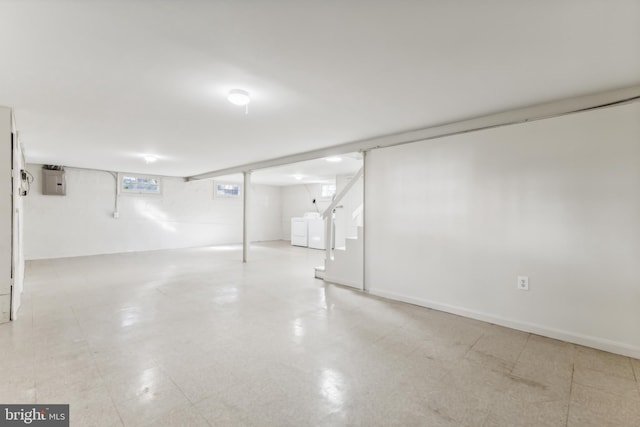 basement with separate washer and dryer and electric panel