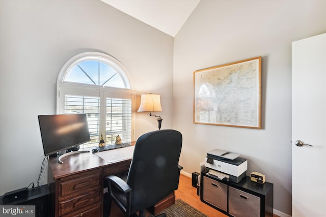 office space with hardwood / wood-style flooring and lofted ceiling