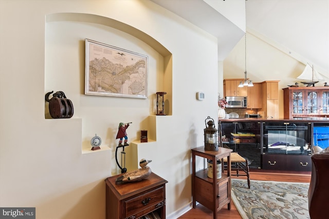 corridor featuring hardwood / wood-style floors