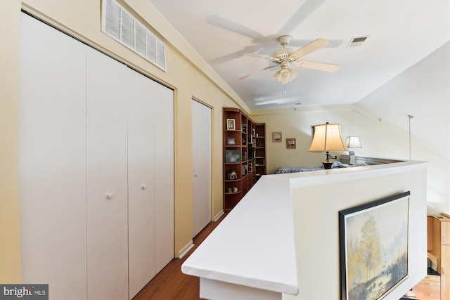 interior space featuring hardwood / wood-style floors, ceiling fan, and lofted ceiling