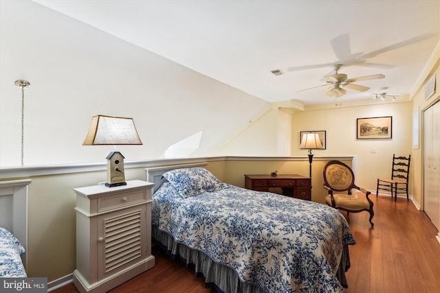 bedroom featuring ceiling fan and dark hardwood / wood-style floors