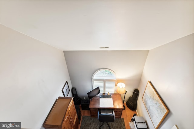 office space with wood-type flooring