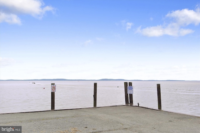 dock area with a water and mountain view