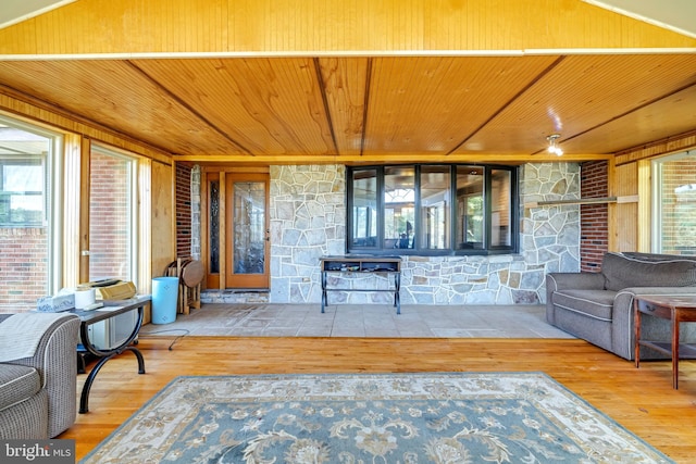 living room featuring hardwood / wood-style floors and wooden ceiling