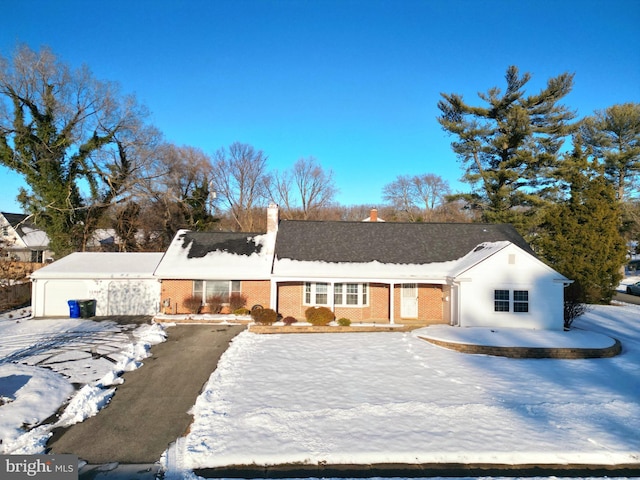 ranch-style house with brick siding and a chimney