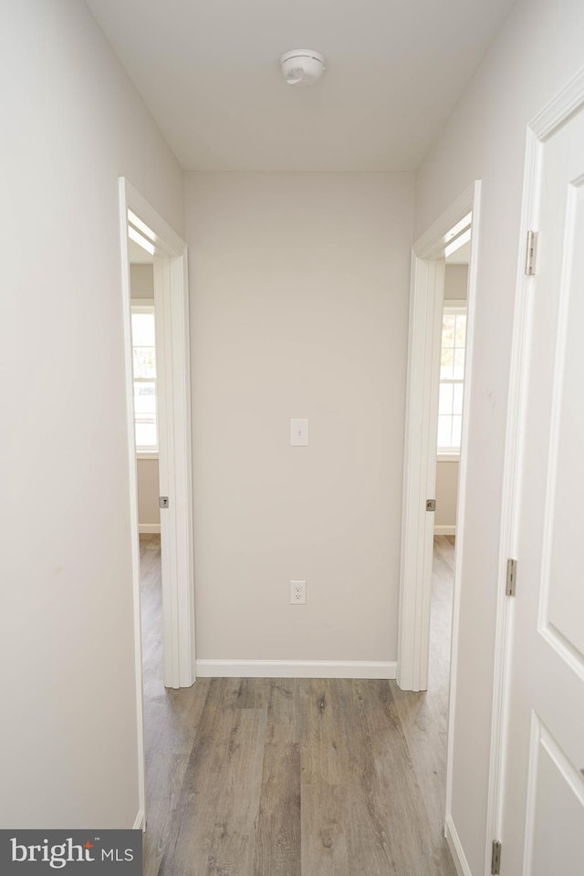 corridor featuring light hardwood / wood-style flooring