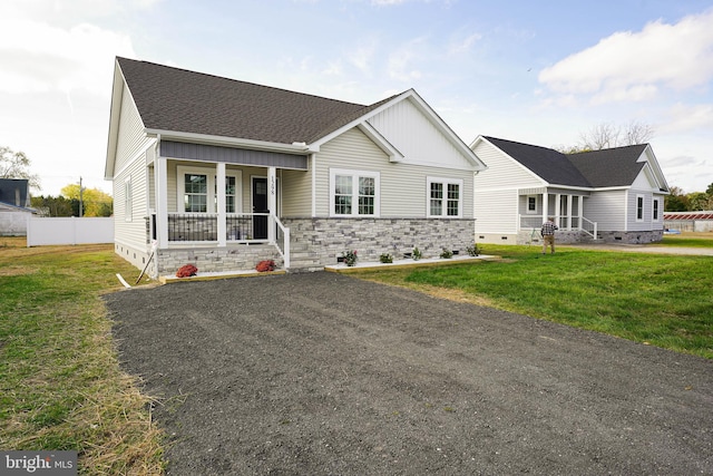 view of front of home with a front lawn and a porch