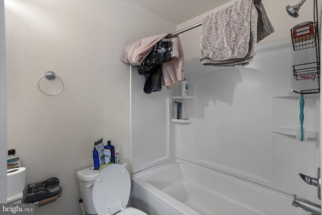 bathroom featuring toilet and bathtub / shower combination