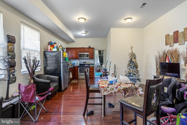 dining area featuring dark hardwood / wood-style flooring