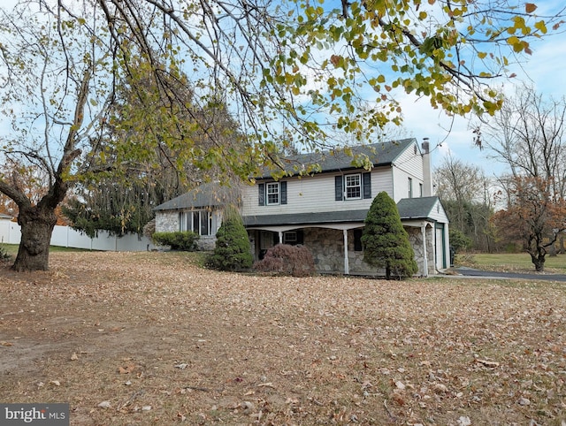 front facade with a garage