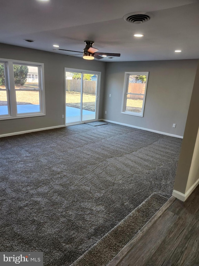 unfurnished room with ceiling fan and dark hardwood / wood-style floors