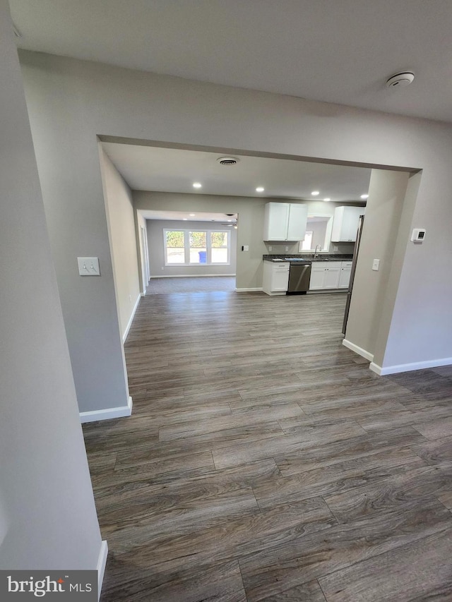 unfurnished living room featuring hardwood / wood-style flooring