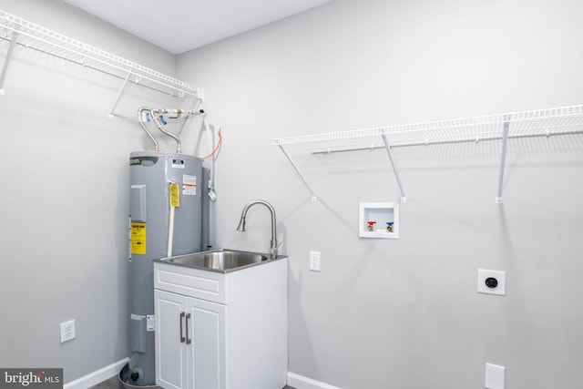 clothes washing area featuring sink, cabinets, washer hookup, hookup for an electric dryer, and electric water heater