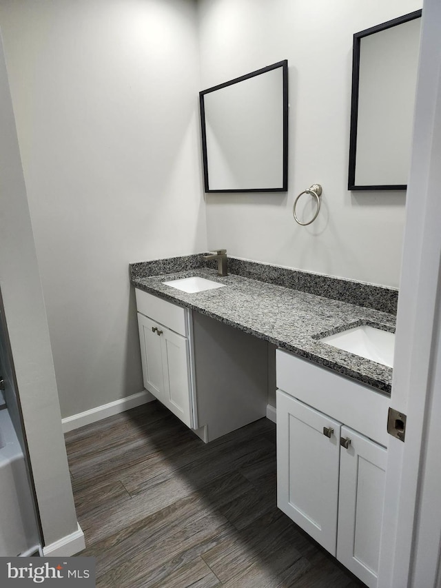 bathroom featuring vanity and wood-type flooring