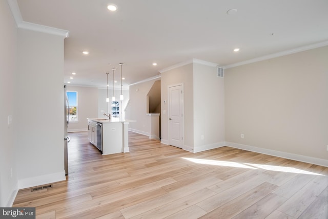 interior space featuring sink, light hardwood / wood-style floors, and ornamental molding