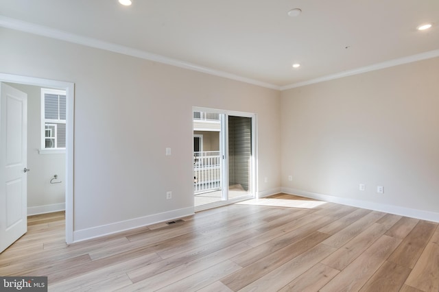 unfurnished bedroom featuring light wood-type flooring and ornamental molding