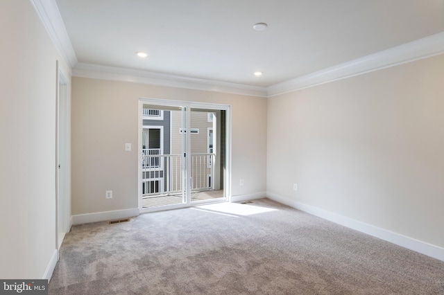 carpeted empty room with crown molding