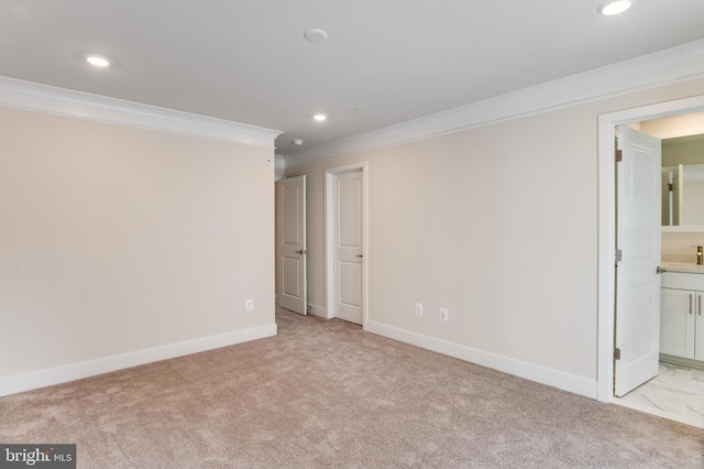 carpeted empty room featuring ornamental molding