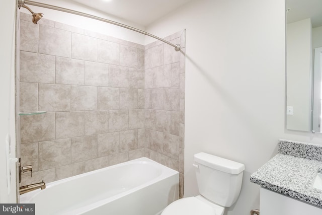 full bathroom with vanity, toilet, and tiled shower / bath