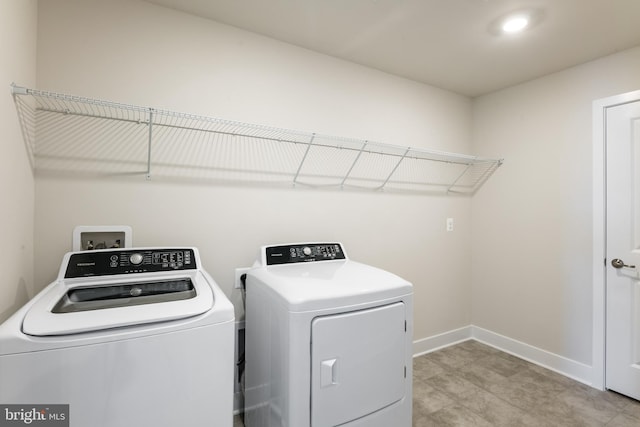 laundry area with washing machine and dryer