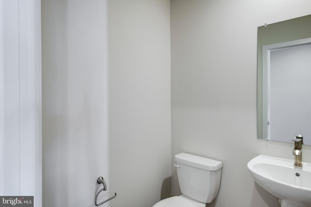 bathroom with sink and toilet