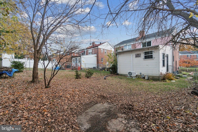 back of property featuring ac unit