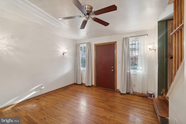 entrance foyer with hardwood / wood-style floors and ceiling fan