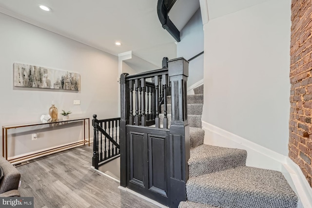 staircase featuring hardwood / wood-style flooring