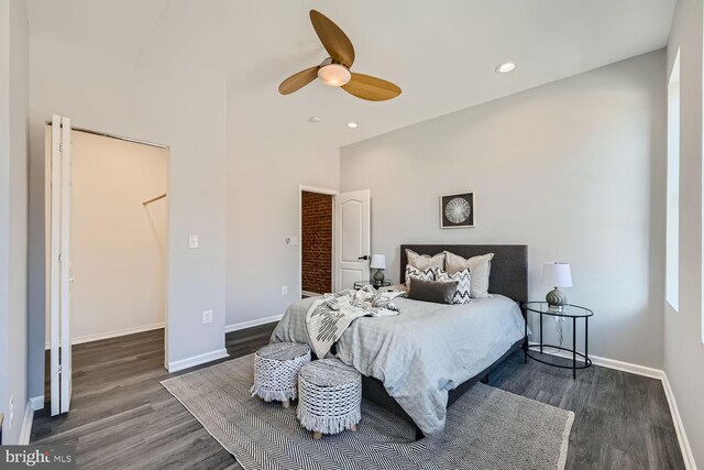 bedroom with ceiling fan and dark hardwood / wood-style floors