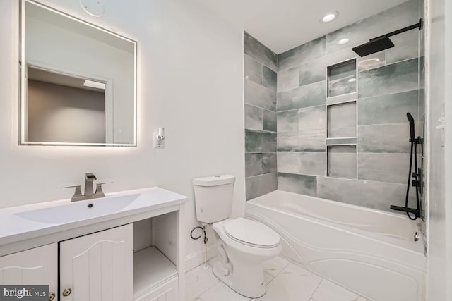 full bathroom featuring vanity, tiled shower / bath combo, and toilet