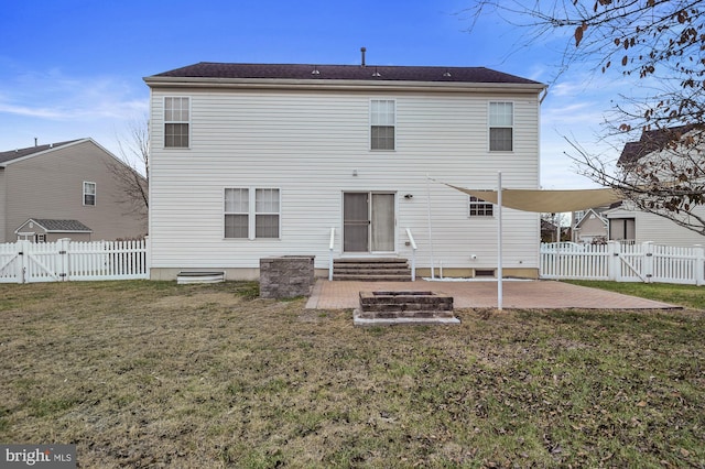 rear view of property featuring a patio area and a yard