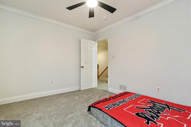 bedroom featuring ceiling fan, carpet, and ornamental molding